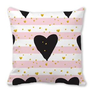 Detail of pink stripes with gold dots and a black heart on peach skin pillowcase