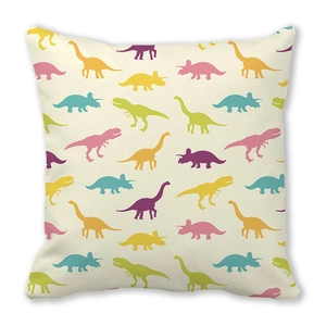 Close-up of colorful cartoon dinosaur silhouettes on soft peach skin fabric cover