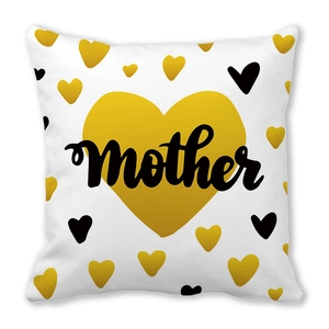 Macro shot of peach skin fabric cushion cover with golden heart and mother art text