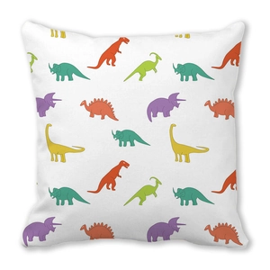 Detailed close-up showing vibrant cartoon dinosaur patterns on soft white peach skin fabric