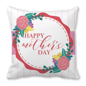 Detail of pink striped cushion cover with floral Mother's Day wreath and festive text