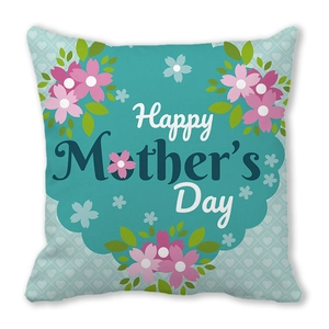 Close-up of Happy Mother's Day cushion cover with pink floral prints on blue fabric