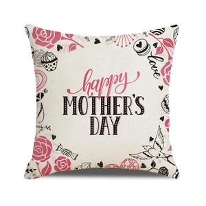 Close-up of linen cushion cover featuring Happy Mother's Day text and floral elements