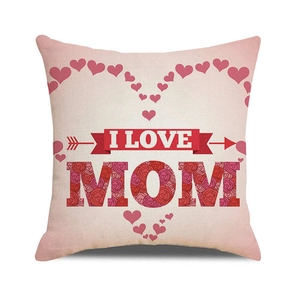 Detail of linen cushion cover with red hearts and floral MOM text for Mother's Day