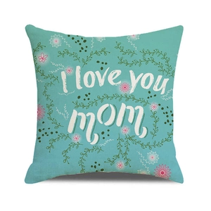 Close-up of turquoise linen pillowcase with floral vine and I love you mom text