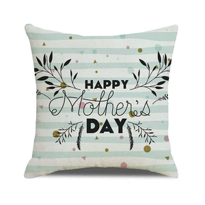 Macro detail of linen Mother's Day pillowcase with Happy Mother's Day print and foliage