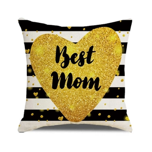 Macro shot of striped linen pillow case with gold heart and Best Mom lettering