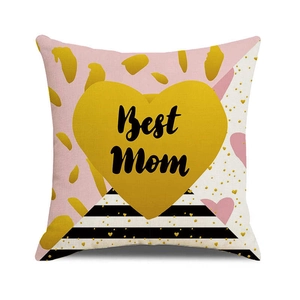 Macro detail of linen texture on Best Mom pillow cover with gold heart design