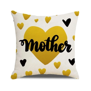 Detail of linen pillowcase with yellow heart and artistic black mother lettering