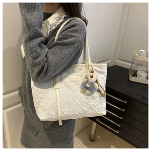 White pleated tote bag with Tidal Dryness logo and cute teddy bear charm detail