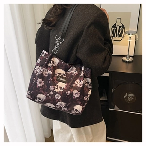 Detailed view of gothic skull and floral print on stylish large capacity shoulder tote bag