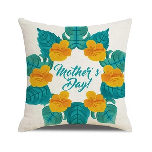 Close-up of linen cushion cover with Mother's Day floral wreath and palm leaf texture