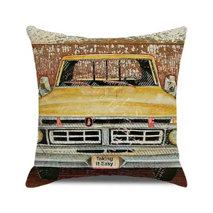 Detail of vintage yellow pickup truck print with LOVE lettering on a beige cushion cover