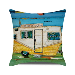 Detail of artistic watercolor cushion cover featuring a vintage camper and ocean art style