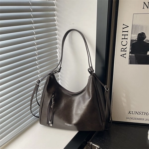 Deep coffee leather hobo bag with tassel zipper and adjustable shoulder strap