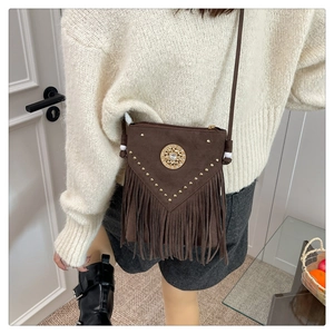 Brown suede bohemian bucket bag with V-shaped rivets and long fringe details