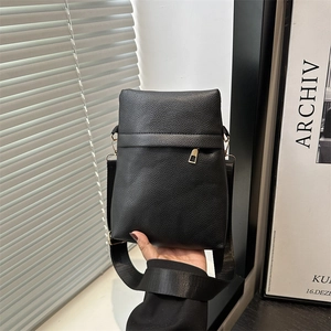 Modern black lychee pattern leather crossbody bag with wide strap and gold zipper