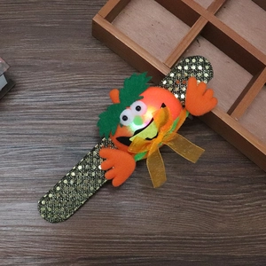 Glow Halloween LED pumpkin slap bracelet with gold sequins on orange band for kids