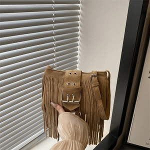 Retro camel suede shoulder bag with long tassels and wide decorative metal buckle strap