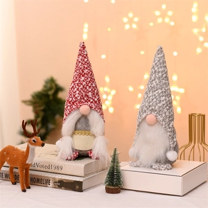 Pair of Scandinavian Christmas gnomes with knitted floral hats and plush white beards