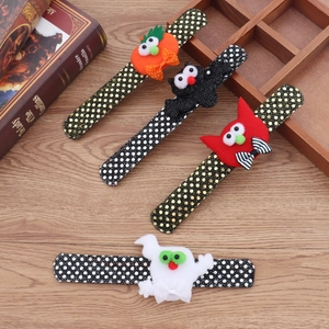 Detailed view of Halloween LED slap bracelets featuring pumpkin, bat, and ghost designs