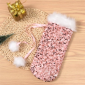 Pink sequin Christmas wine bag with plush white faux fur trim and decorative pompoms