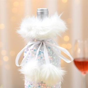 Detail of white sequin wine bottle cover with faux fur collar and plush pom-poms