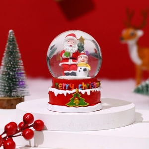 Detailed Christmas snow globe with Santa and snowman on red Merry Christmas base