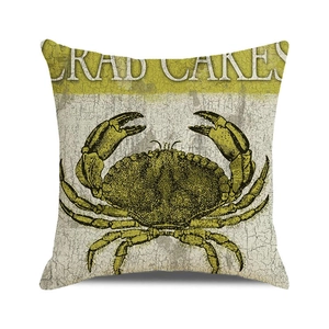 Detail of vintage crab illustration and textured linen fabric on square cushion cover