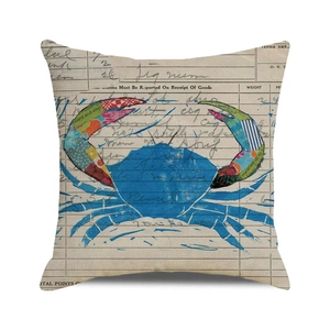 Detail of vintage artistic cushion cover with a blue patchwork crab on invoice background