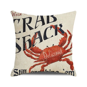Detail of vintage crab print on beige linen pillow case featuring Crab Shack graphics