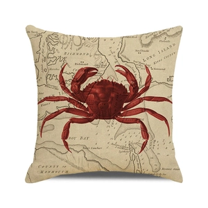 Detail of red crab print and nautical map pattern on canvas square throw pillow cover