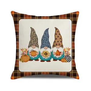 Detail view of gnome harvest pillow cover with leopard print hats and checkered border