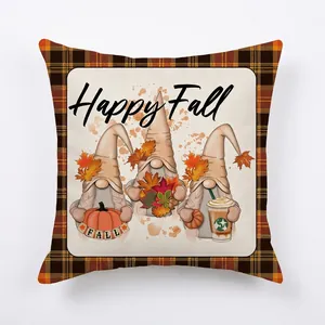 Detail of Happy Fall linen pillow case featuring three gnomes and orange plaid border