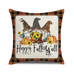 Detail of square fall cushion cover with gnomes, pumpkins and black orange plaid border
