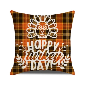Detail view of cotton linen pillowcase with orange black plaid and Happy Turkey Day print