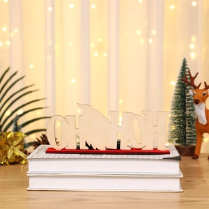 Detail of wooden HO HO HO Christmas tabletop ornament with gnome cutout on red base
