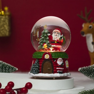 Detailed view of musical Christmas snow globe with Santa and warm glowing LED lights