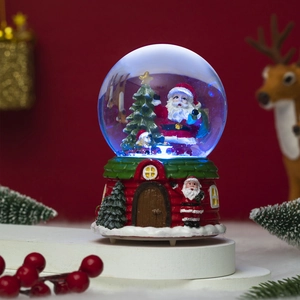 Close-up of a Christmas snow globe with Santa Claus, blue LED light, and red festive base