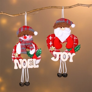 Christmas snowman and Santa cloth ornaments with wooden Noel Joy signs and bells