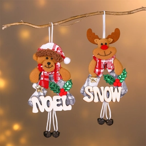 Christmas reindeer and bear wooden ornaments with NOEL and SNOW text on pine branches