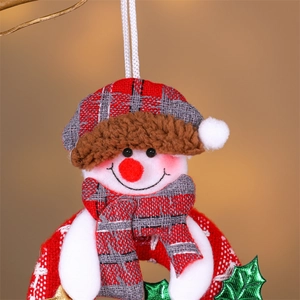 Detail of Christmas snowman ornament with red checkered hat and fuzzy lamb wool trim
