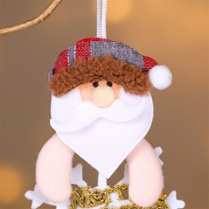 Detail of fabric Santa ornament with Merry Christmas text on a white snowflake base