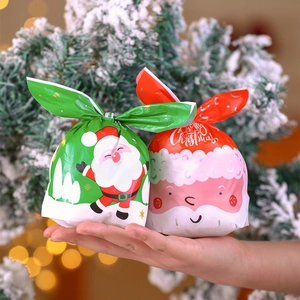 Christmas gift bags with Santa Claus designs and drawstring closure for holiday treats