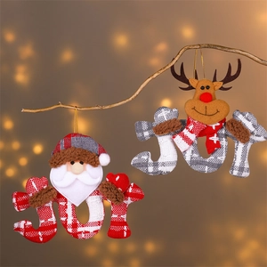 Plaid JOY letter ornaments with Santa and reindeer hanging on a branch with warm lights