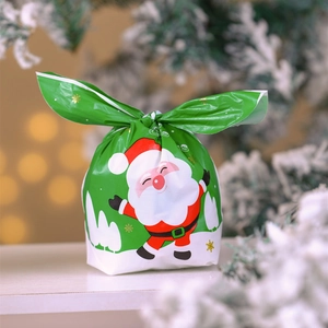 Green Christmas gift bag with Santa Claus print and bunny-ear tie closure for candy
