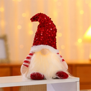 Lighted Christmas gnome with red sequin hat and white beard on a display stand
