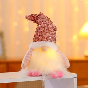 Lighted Christmas gnome ornament with pink sequin hat and warm LED glowing beard