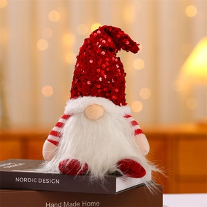 Close-up of a Christmas gnome doll with red sequin hat and white plush beard