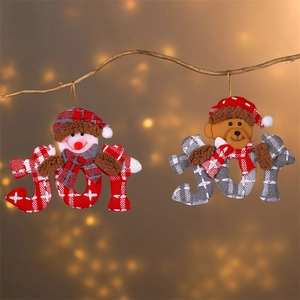 Christmas JOY letter ornaments with plush snowman and bear hanging on wooden branch